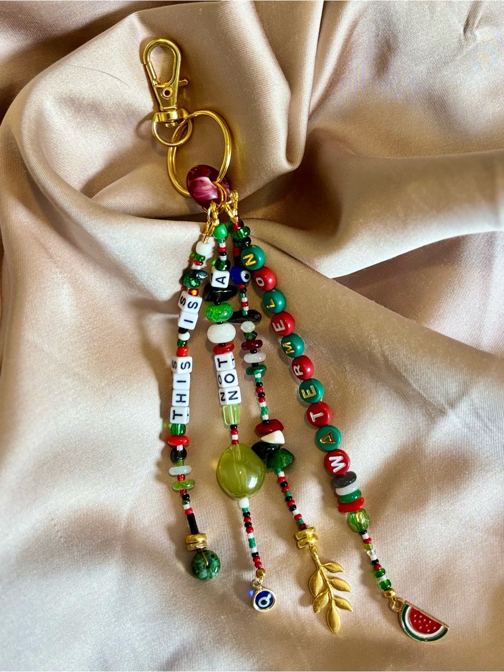 Bag charm 🍉🗝️🕊️🧿 with Gold Hardware. Handmade and designed by seller